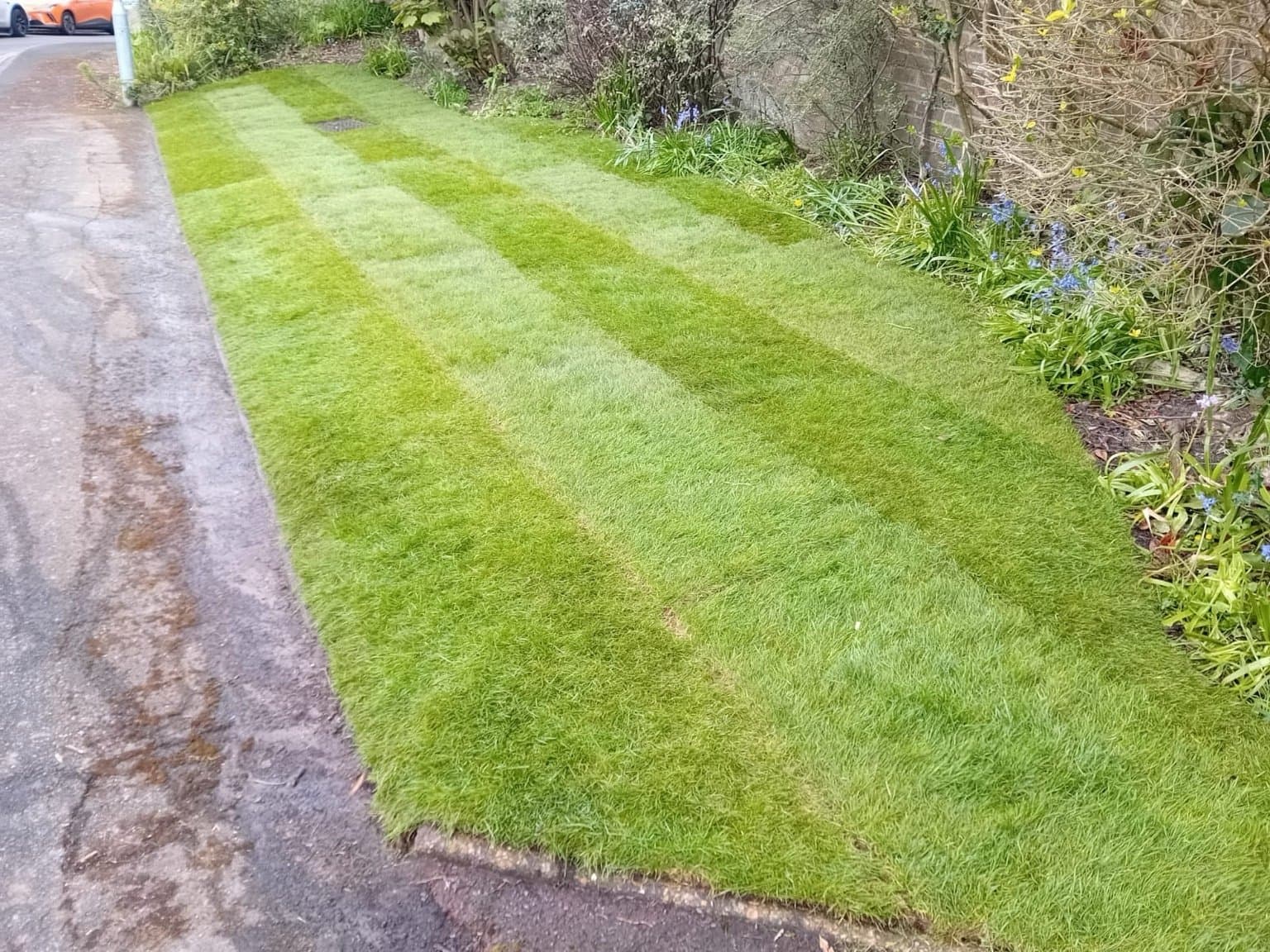 Full landscaping job including turfing, fencing and patio installation